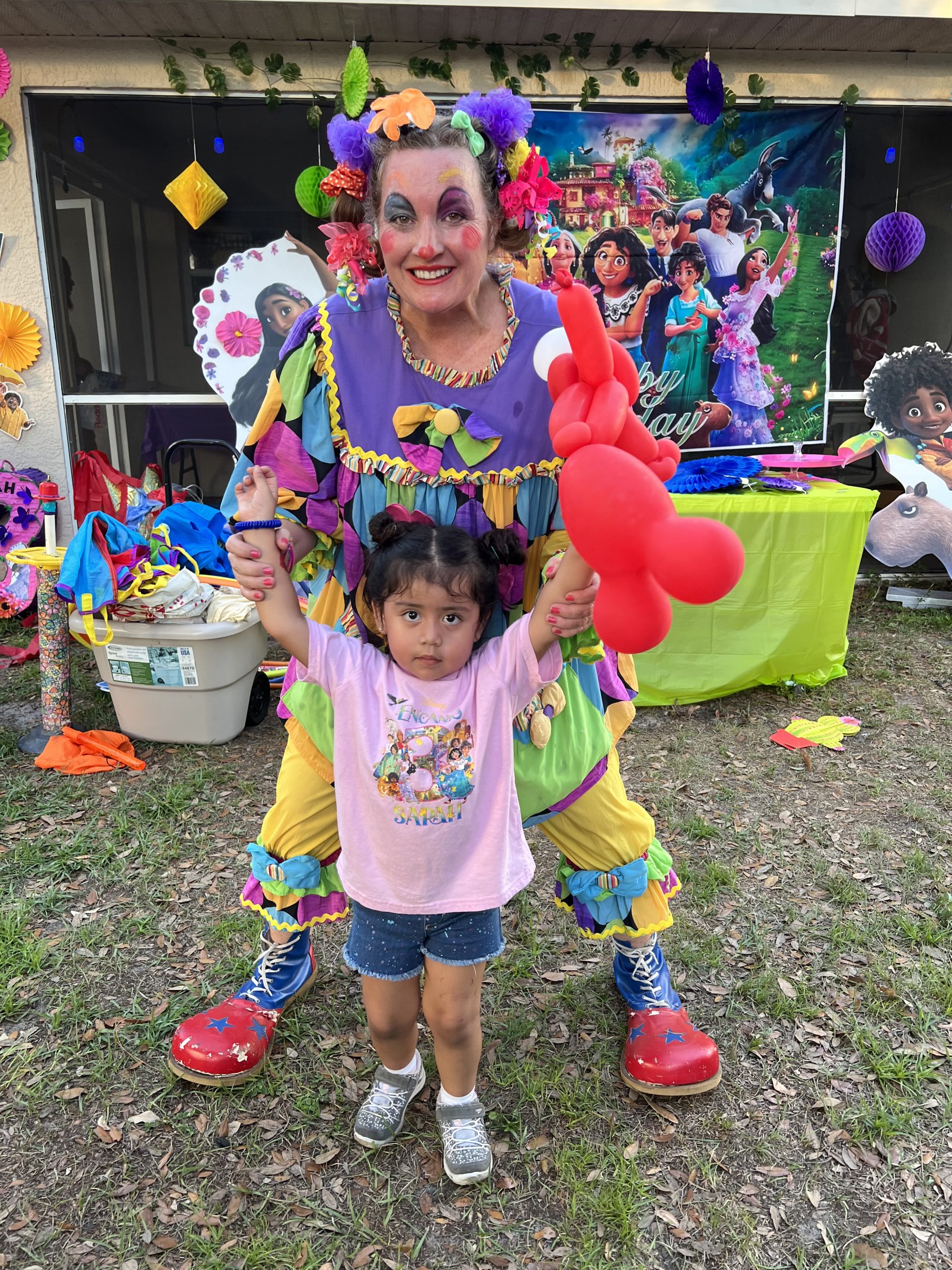 Face painting party entertainer with child